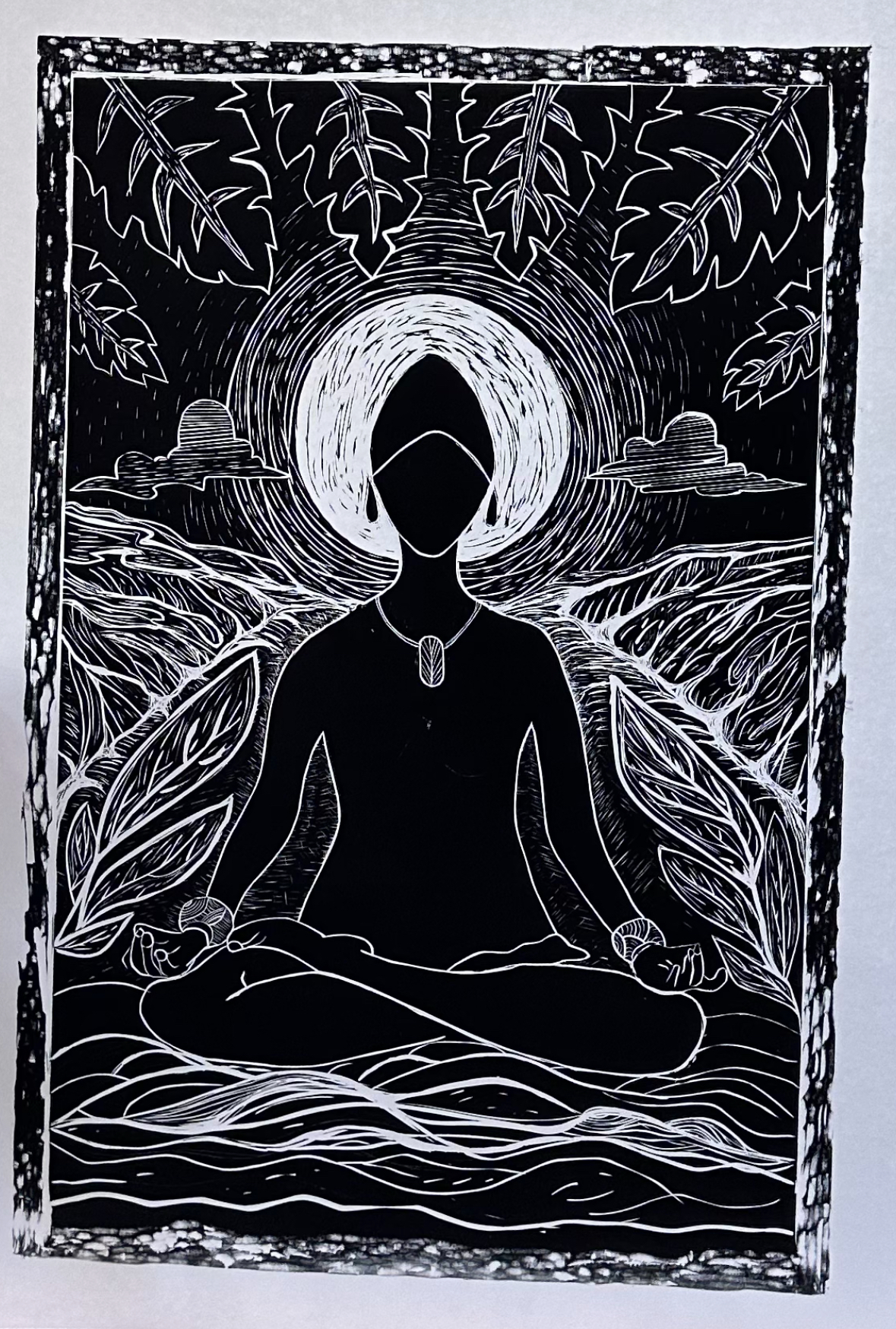 Still, I Shine, woodblock print of a meditating figure with a glowing halo surrounded by leaves
